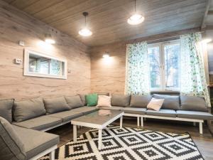 a living room with a couch and a table at Eurohostel in Helsinki
