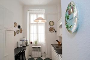 a kitchen with a sink and a counter top at Hungarian Souvenir in Budapest