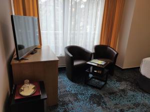 TV a/nebo společenská místnost v ubytování Hotel Oya