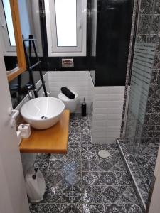 a bathroom with a sink and a shower at Super Stylish Apartments in Syntagma Square! in Athens