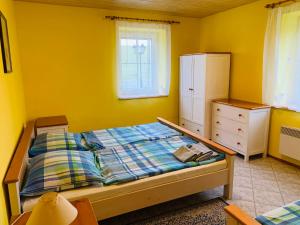 Postel nebo postele na pokoji v ubytování Penzion Rozalie