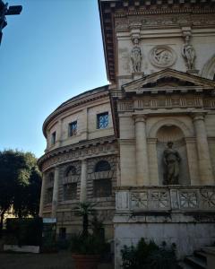 a building with a statue in front of it at Termini Binario 1&2 in Rome