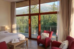 Postel nebo postele na pokoji v ubytování Apartmány Tatry
