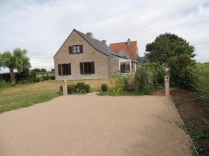 a house with a walkway in front of it at Vakantiehuis " Te Lande " in Torhout