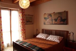 Postel nebo postele na pokoji v ubytování Bed & Breakfast Lucy