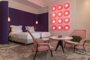 Postel nebo postele na pokoji v ubytování Yndo Hôtel