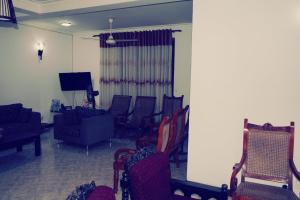 Un televizor și/sau centru de divertisment la A&A Homestay