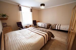 Postel nebo postele na pokoji v ubytování Hotel Pod Zámkem + 37 fotografií