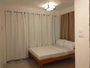 Postel nebo postele na pokoji v ubytování Zenith Inn & Resto Bar