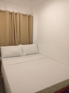 Postel nebo postele na pokoji v ubytování Zenith Inn & Resto Bar