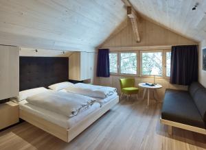 A bed or beds in a room at Försterhaus Mellau