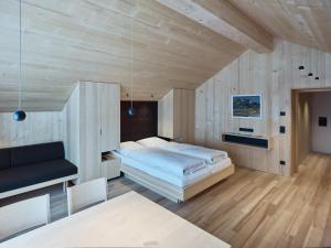 A bed or beds in a room at Försterhaus Mellau