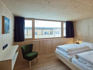 A bed or beds in a room at Försterhaus Mellau
