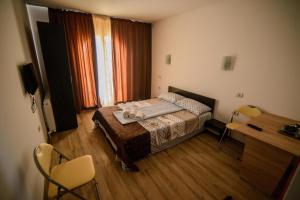 Tempat tidur dalam kamar di Vila Onasis