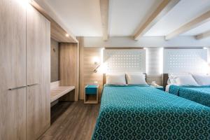 Una cama o camas en una habitación de Hotel Casa Blanca
