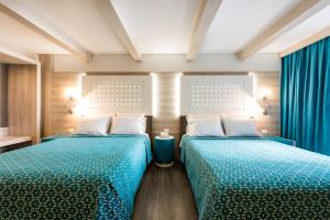Una cama o camas en una habitación de Hotel Casa Blanca
