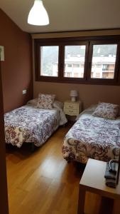 Ένα ή περισσότερα κρεβάτια σε δωμάτιο στο El Balcón del Sella +31 φωτογραφίες
