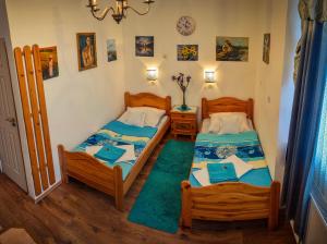 Postel nebo postele na pokoji v ubytování Guesthouse Ilona + 86 fotografií