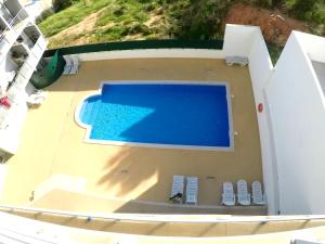 an overhead view of a swimming pool on a cruise ship at SunHouse Room in Albufeira