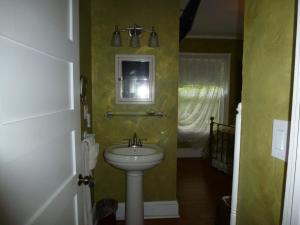 a bathroom with a sink and a mirror at Back INN Time B&B in Kilmarnock
