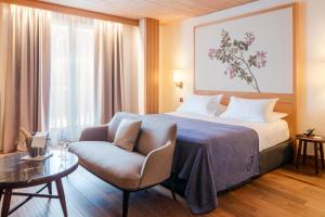 Postel nebo postele na pokoji v ubytování Faloria Mountain Spa Resort