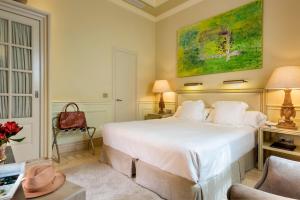 Posteľ alebo postele v izbe v ubytovaní Hotel Casa Del Poeta