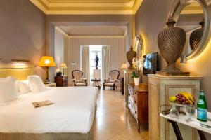 Posteľ alebo postele v izbe v ubytovaní Hotel Casa Del Poeta