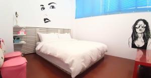 Letto o letti in una camera di Wushih Surf Hostel