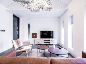 a living room with a couch and a tv at Patio 7 in Seoul