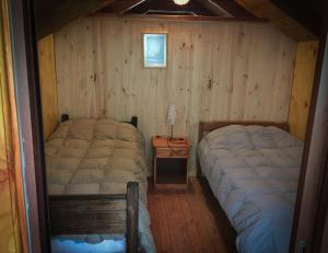 Ένα ή περισσότερα κρεβάτια σε δωμάτιο στο Llaima Camp