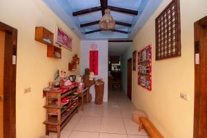 a room with a kitchen with a table in it at DOWN HWA NO.8 in Pinghe