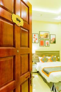 Voodi või voodid majutusasutuse VF Hotel Dalat toas