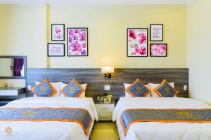 Voodi või voodid majutusasutuse VF Hotel Dalat toas