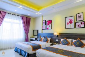 Voodi või voodid majutusasutuse VF Hotel Dalat toas