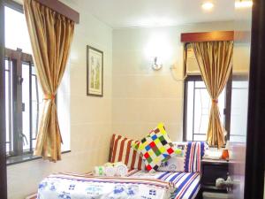 Postelja oz. postelje v sobi nastanitve First Inn Hotel & Guest House Reception at 10TH F, Block E