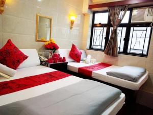 Postelja oz. postelje v sobi nastanitve First Inn Hotel & Guest House Reception at 10TH F, Block E