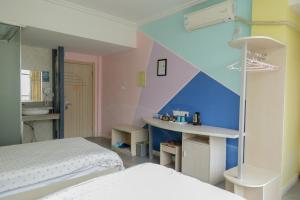 Postel nebo postele na pokoji v ubytování Kunlun International Youth Hostel