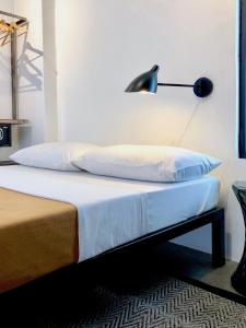 Postel nebo postele na pokoji v ubytování Gomez House