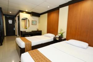 Ein Bett oder Betten in einem Zimmer der Unterkunft Lispher Inn