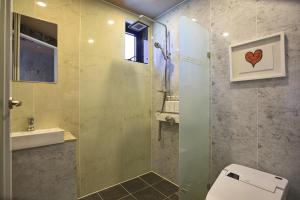 Koupelna v ubytování MG Hotel + 34 fotografií