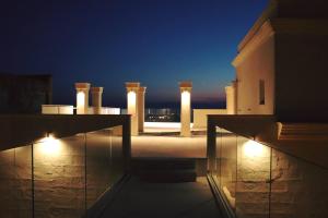 a view of a building at night with lights at MONUN Hotel&Spa in Grottaglie