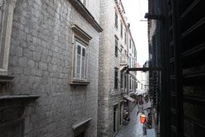 an alley in an old city with buildings at Kaboga street Rooms in Dubrovnik