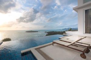 a view of the ocean from a house with a pool at Villa Thalassa Absolute Sunrise Seaview in Chaweng