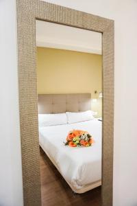 Tempat tidur dalam kamar di Hotel Lidar