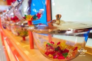 a counter with a bowl filled with colorful ingrediants at Hard Rock Hotel Desaru Coast in Desaru