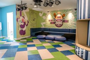 a childrens room with a mickey mouse mural on the wall at Hard Rock Hotel Desaru Coast in Desaru