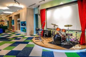 a room with a drum set on a stage at Hard Rock Hotel Desaru Coast in Desaru
