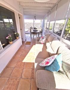 A seating area at VILLA OLIVEIRA by Buenavilla