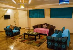 A seating area at Jamila cosy apartment