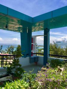 a blue building with a view of the water at Huong Bien Hotel in Phan Rang